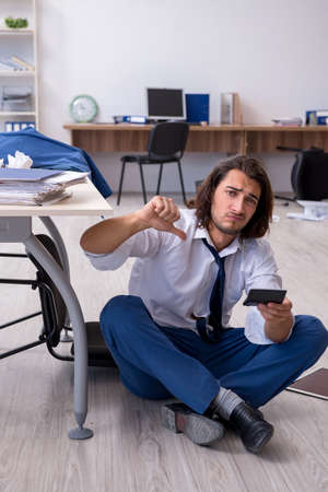 Young male employee unhappy with his workの写真素材