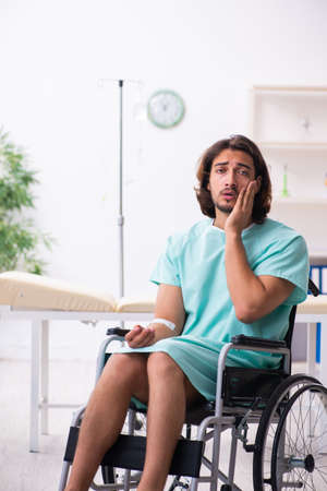 Young male patient in blood transfusion conceptの写真素材