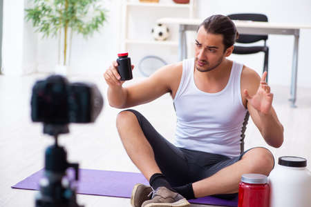 Young male blogger in dieting conceptの写真素材