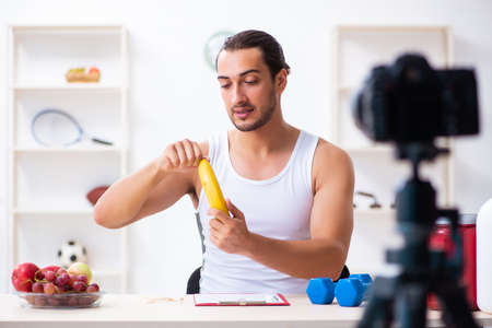 Young male blogger in dieting conceptの写真素材