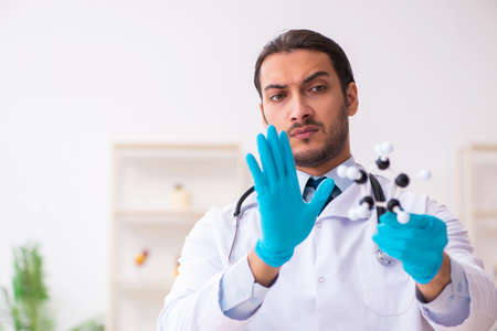 Doctor working in lab in coronavirus COVID-19 conceptの写真素材