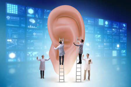The doctor examining giant ear in medical conceptの写真素材