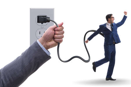 Businessman being powered by electricity and plugの写真素材
