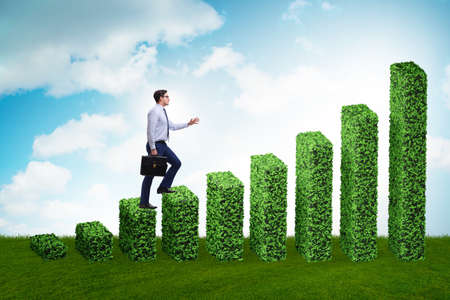 Businessman in the green ecology growth conceptの写真素材