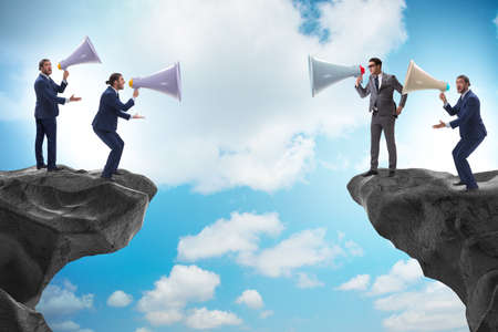 The businessman shouting with loudspeaker at each other