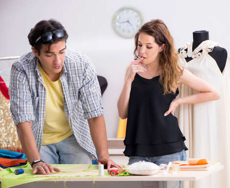 Young tailor working in his workshopの写真素材