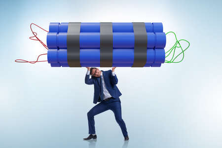 Desperate businessman with dynamite sticks