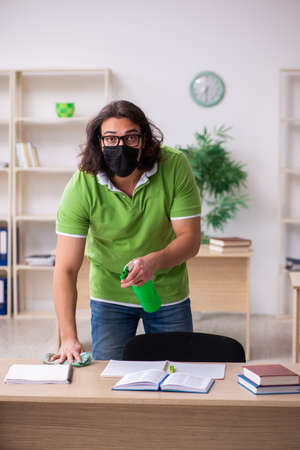 Young man student studying at home in self-isolation conceptの写真素材