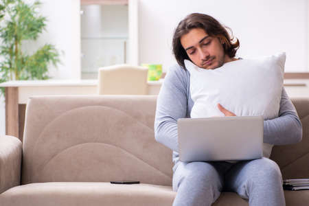 Young male employee freelancer working from homeの写真素材