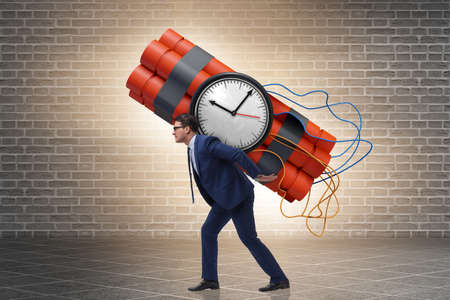 Desperate businessman with dynamite sticksの写真素材