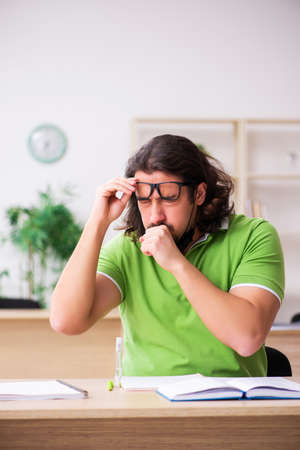 Young man student studying at home in self-isolation conceptの写真素材