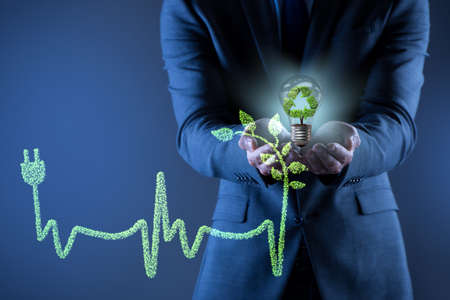 Green energy concept with businessmanの写真素材
