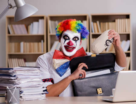 Clown businessman working in the officeの写真素材