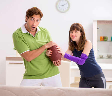 Man and woman discussing sports injuryの写真素材
