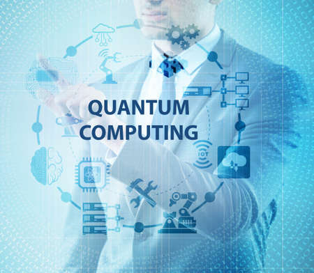 The businessman pressing virtual button in quantum computing conceptの写真素材