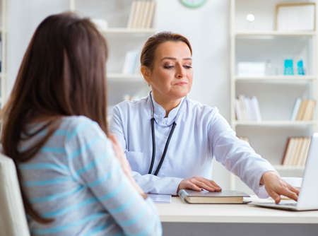 Woman visiting female doctor for regular check-upの写真素材