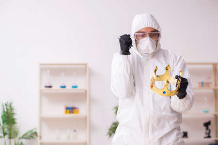 Doctor working in lab in coronavirus COVID-19 conceptの写真素材