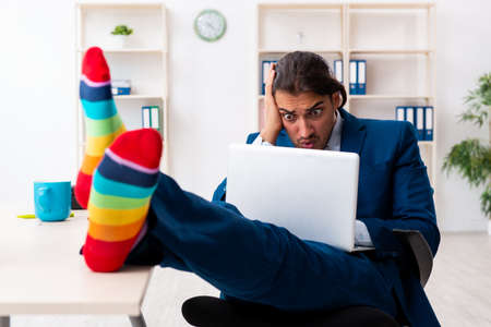 Young male businessman working in the officeの写真素材
