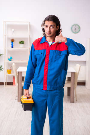 Young male carpenter working indoorsの写真素材