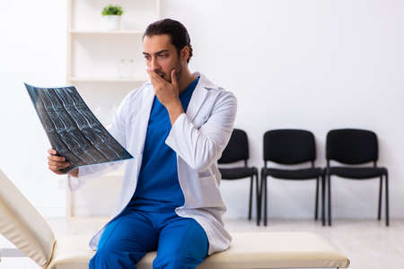Young male doctor working in the clinic