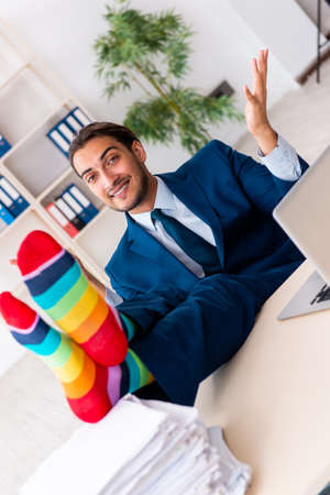 Young male businessman working in the officeの写真素材