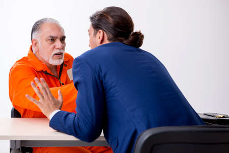 Old captive meeting with advocate in pre-trial detention