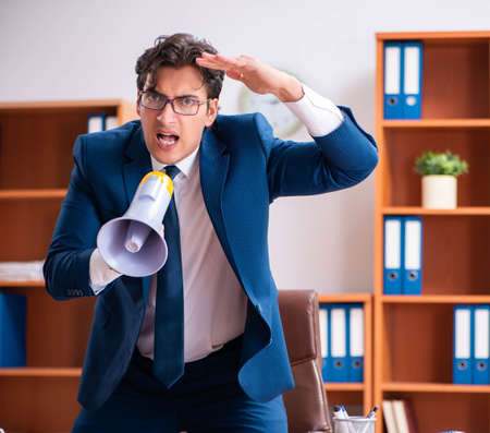 Young handsome businessman working in the officeの写真素材