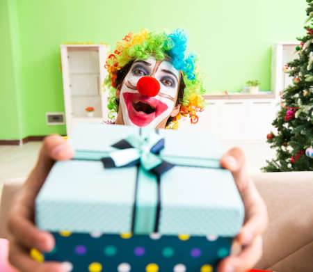 The funny clown in christmas celebration concept