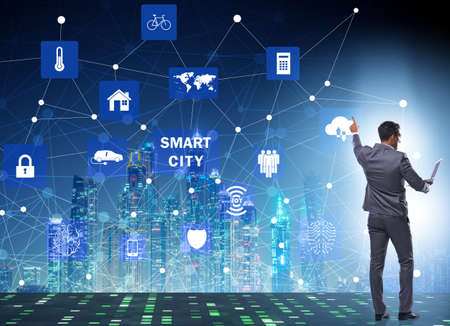 Concept of smart city with businessman pressing buttonsの写真素材