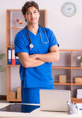 Young handsome doctor working in the hospitalの写真素材