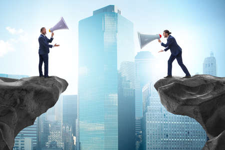 The businessman shouting with loudspeaker at each other