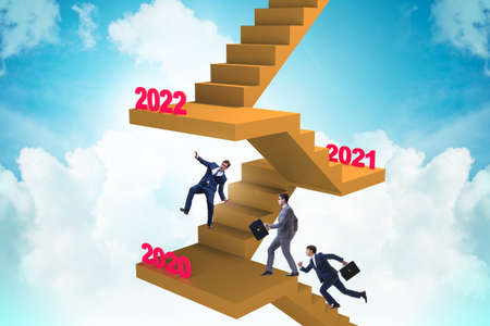 Businessman climbing stairs on yearly basis