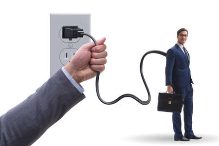 Businessman being powered by electricity and plugの写真素材