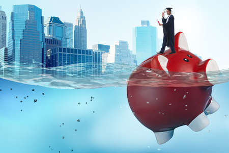 The student debt concept with piggybank and studentの写真素材