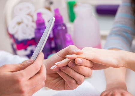 Hands during manicure care sessionの写真素材