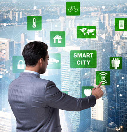 Concept of smart city with businessman pressing buttonsの写真素材