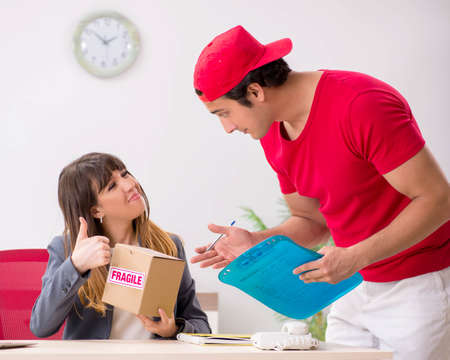 Courier delivering parcel to the office
