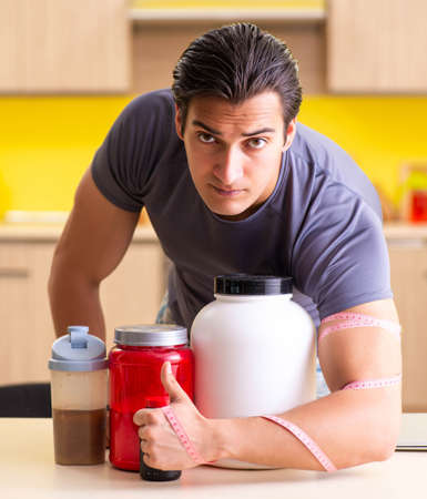 Young man blogging about food supplementsの写真素材