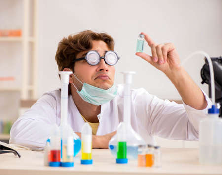 Funny crazy chemist doing experiments and tests