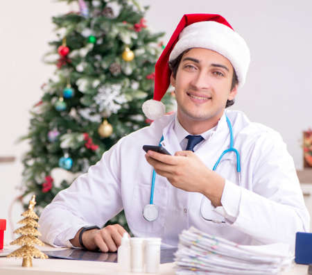 Doctor on the shift on christmas eveの写真素材