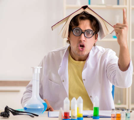 Funny crazy chemist doing experiments and testsの写真素材