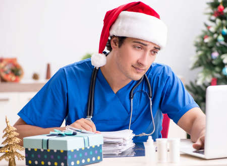 Doctor with gift box in the hospitalの写真素材