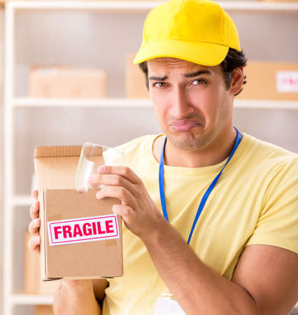 Handsome contractor working in box delivery relocation serviceの写真素材
