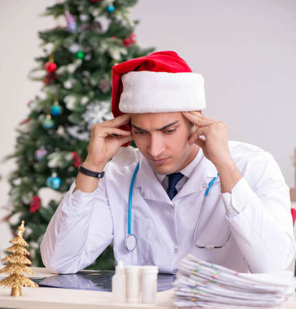 Doctor on the shift on christmas eveの写真素材