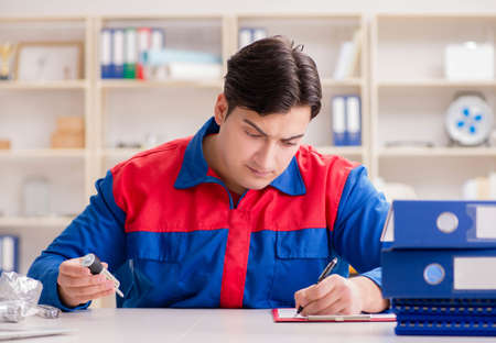 Worker in uniform working on projectの写真素材