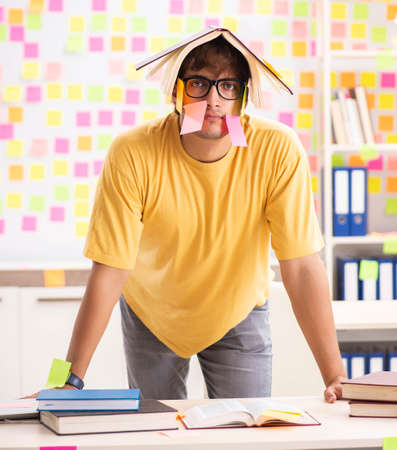 Student preparing for exams with many conflicting prioritiesの写真素材