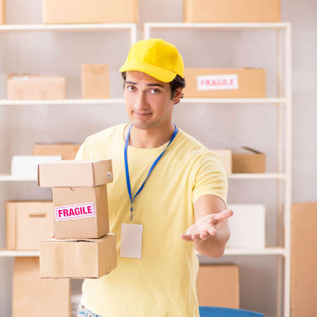 Handsome contractor working in box delivery relocation service