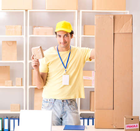Handsome contractor working in box delivery relocation serviceの写真素材
