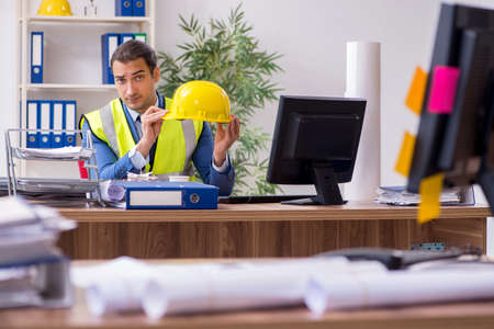 Young male architect working in the officeの写真素材