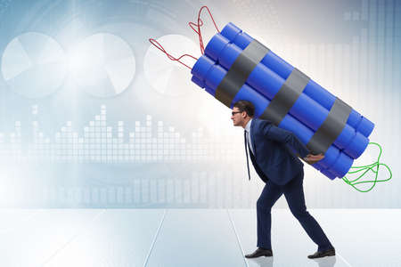 Desperate businessman with dynamite sticksの写真素材